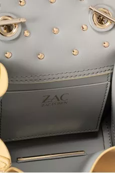 Leather bag decorated with flowers