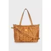 Leather bag with signature print