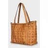 Leather bag with signature print