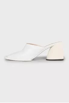White mules with a figured heel