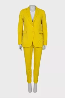 Yellow suit consisting of a jacket and trousers