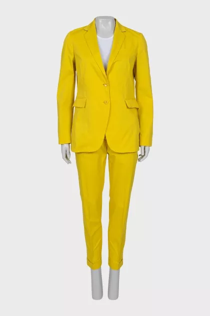 Yellow suit consisting of a jacket and trousers