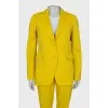 Yellow suit consisting of a jacket and trousers