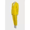 Yellow suit consisting of a jacket and trousers