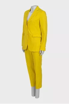 Yellow suit consisting of a jacket and trousers