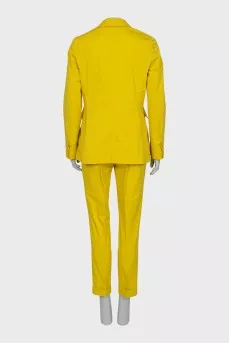 Yellow suit consisting of a jacket and trousers