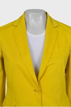 Yellow suit consisting of a jacket and trousers