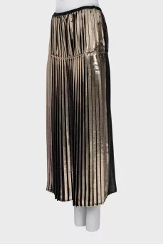 Pleated skirt in gold color