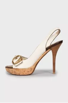 Leather sandals with gold buckles