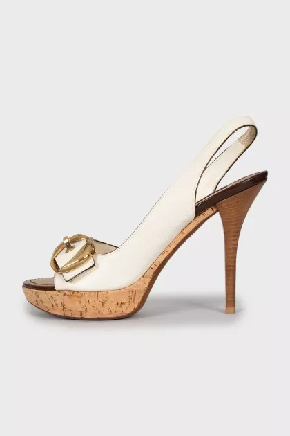 Leather sandals with gold buckles
