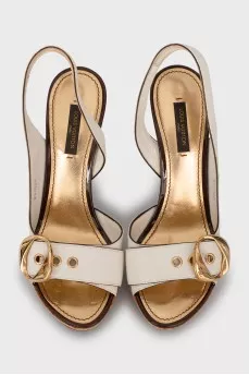 Leather sandals with gold buckles