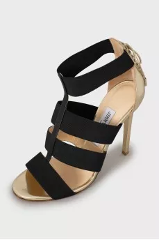 Black and gold stiletto sandals