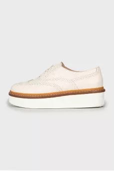 White leather brogues with perforations
