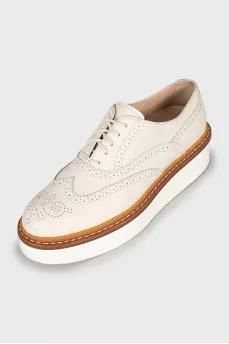 White leather brogues with perforations