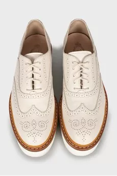 White leather brogues with perforations