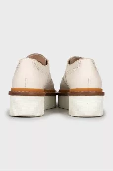 White leather brogues with perforations