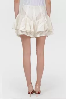 Shorts made of translucent material with stuck with tag