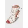 Stiletto heel sandals decorated with flowers