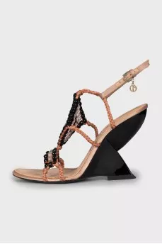 Textile sandals with a figured wedge heel