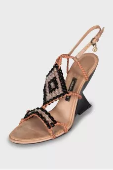 Textile sandals with a figured wedge heel