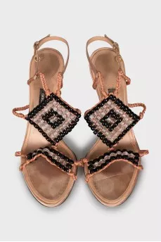 Textile sandals with a figured wedge heel