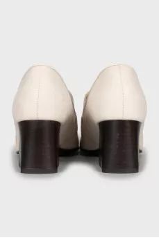 White leather shoes with medium heels