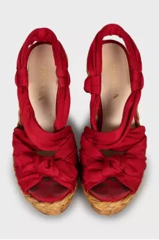 Red sandals with woven soles