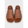Brown leather flip flops
