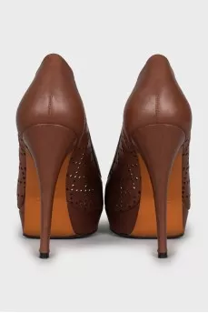 Brown leather shoes with perforation