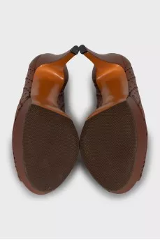 Brown leather shoes with perforation