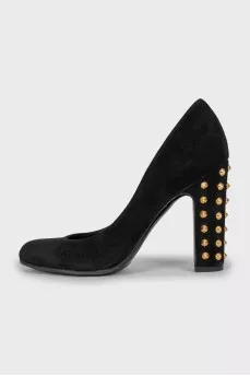 Suede shoes decorated with spikes