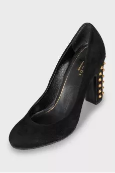 Suede shoes decorated with spikes