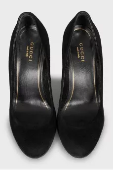 Suede shoes decorated with spikes