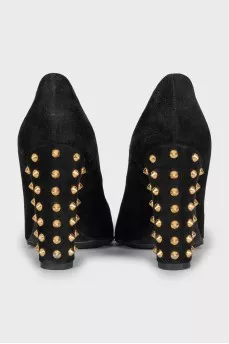 Suede shoes decorated with spikes