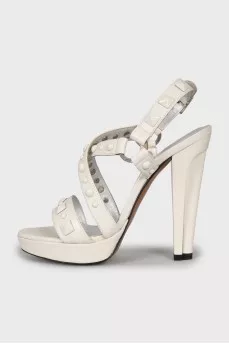 White sandals with metallic decor