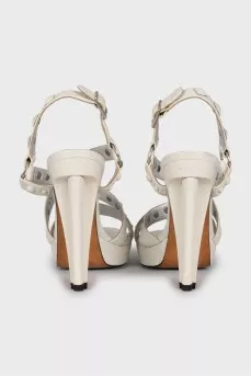 White sandals with metallic decor