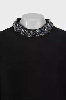 Dress with decorated collar
