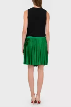 Dress with a green pleated skirt