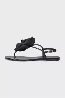 Black sandals decorated with a flower