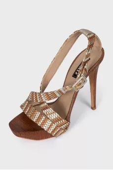 Brown leather and wood sandals