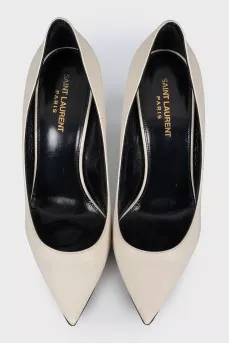 White leather pumps