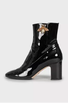 Patent leather ankle boots with signature decor
