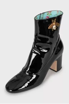 Patent leather ankle boots with signature decor