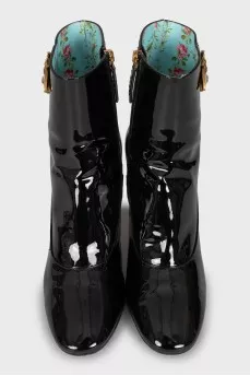 Patent leather ankle boots with signature decor