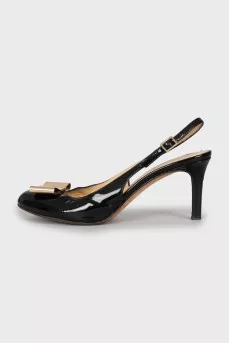Patent leather slingbacks with golden bow