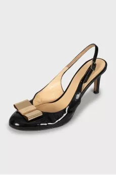 Patent leather slingbacks with golden bow