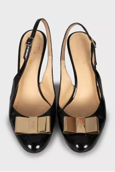 Patent leather slingbacks with golden bow