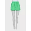 Green suit of shirt and shorts