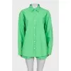 Green suit of shirt and shorts