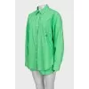 Green suit of shirt and shorts